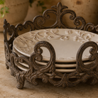 Close-up of intricate acanthus leaf scrollwork on the cast iron plate stand.