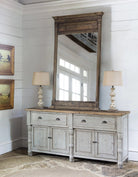 Farmhouse room setting with sideboard, lamps and large mirror - Your Western Decor