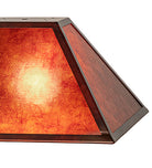 Rectangle amber mica lamp shade with iron frame detail. Light is on