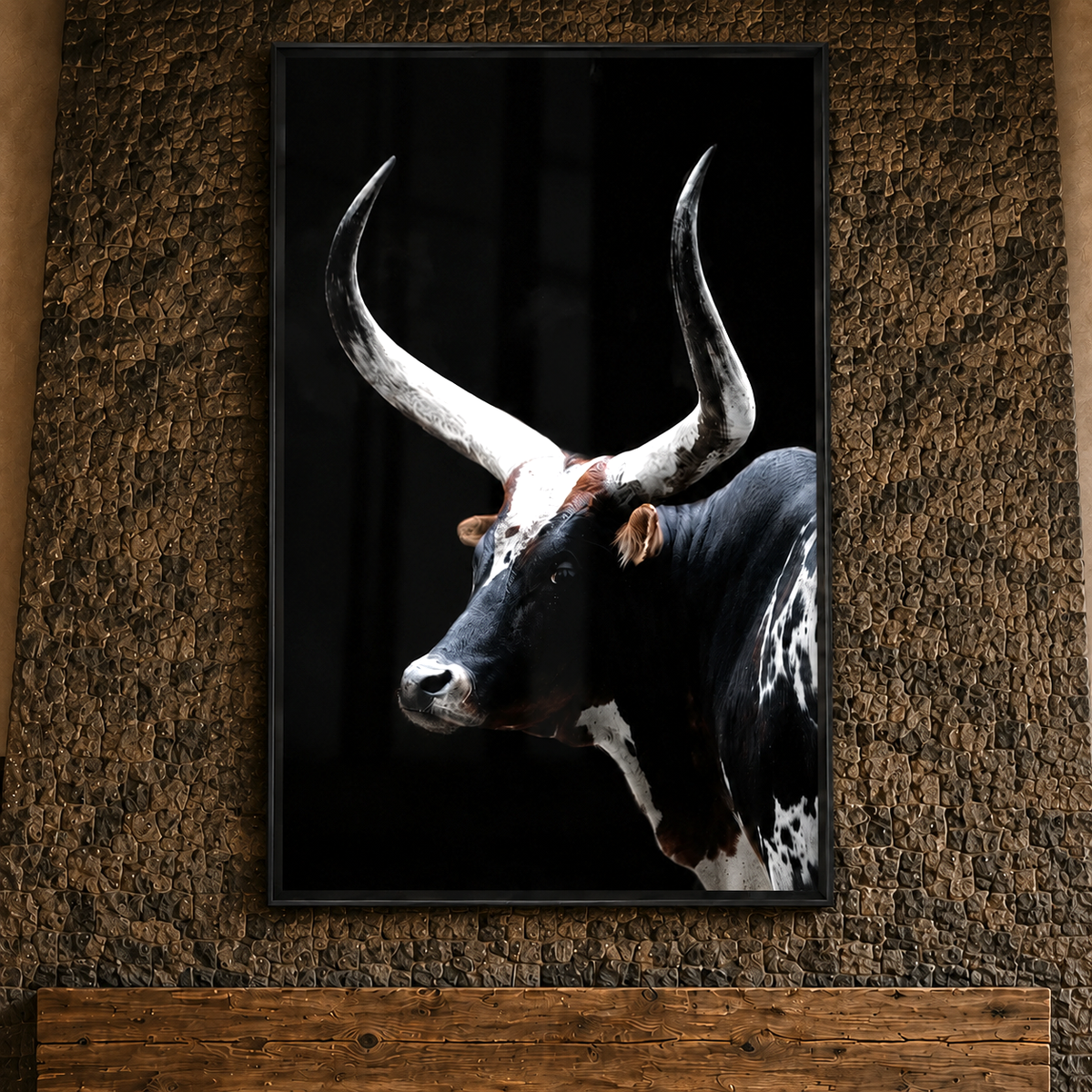 Tempered glass framed Watusi wall art hanging on stone fireplace over wood beam mantle 