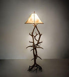 Antler floor lamp made from real elk and mule deer antlers with natural rawhide shade for rustic lodge lighting