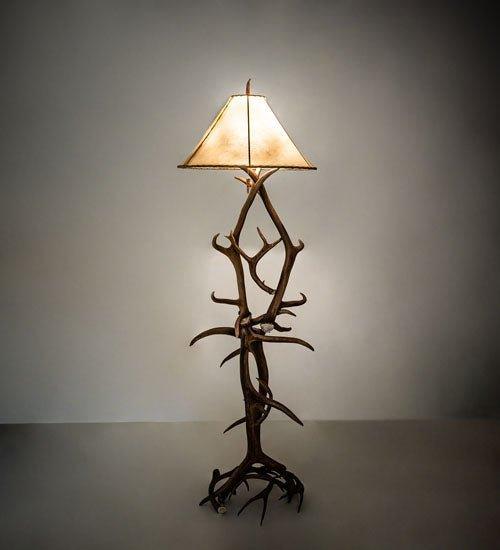 Antler floor lamp made from real elk and mule deer antlers with natural rawhide shade for rustic lodge lighting