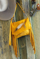 Gold Arapaho Painted Feather deerskin leather handbag with hand-painted feather motif, long fringe and crossbody strap