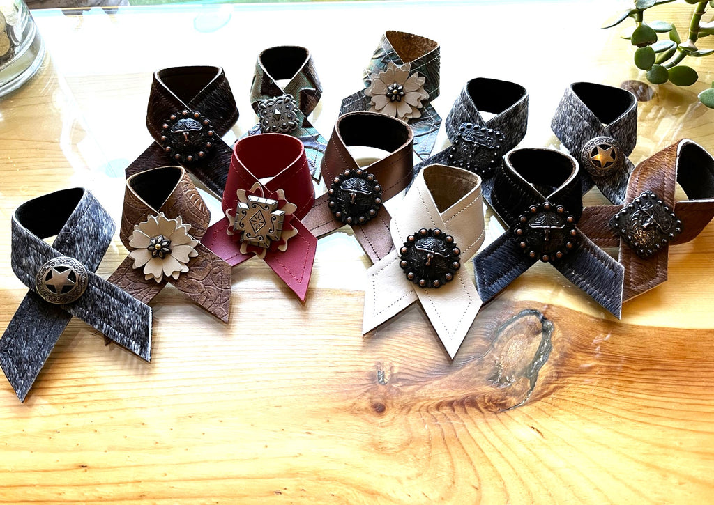 Handmade leather and cowhide napkin rings made by Randee McKague at Your Western Decor