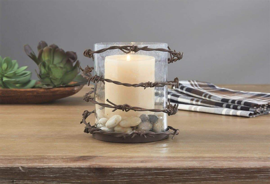 Bubble glass and barbed wire pillar candle holder. Your Western Decor