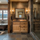 Bathroom with wooden vanity, freestanding bathtub, and mountain view - Your Western Decor