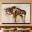 Large framed abstract canvas art featuring a dark brown and beige gestural bison figure on a warm off-white background, displayed above a brown leather headboard with neutral pillows.