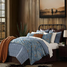 Western themed bedroom with cowboy art and blue mesa rodeo bedding set with accents