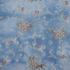Patterned fabric with cowboy and horse design on a blue background
