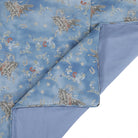 Blue duvet with horse and floral pattern on a white background