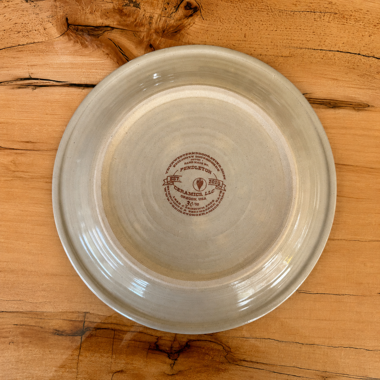Blue Mountain Brands plate bottom showing Pendleton Ceramics, LLC as the manufacturer from Pendleton, Oregon for Your Western Decor