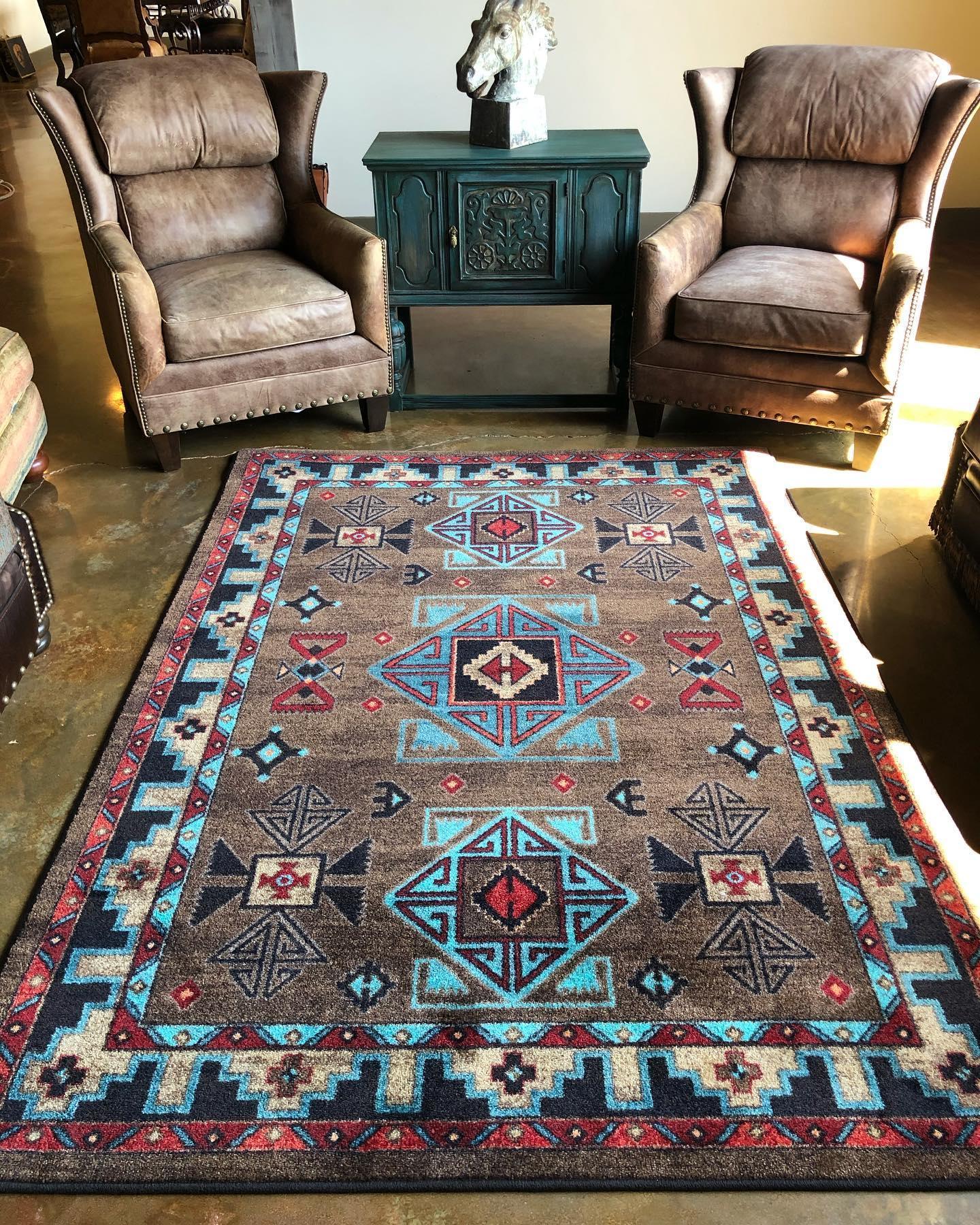 Decorative rug with geometric pattern in a room with chairs and a side table