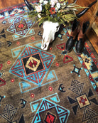 Blue Zircon Southwestern Rug in geometric patterns of turquoise, red, beige and black over distressed brown background 