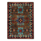 Blue Zircon Southwestern Rug in geometric patterns of turquoise, red, beige and black over distressed brown background 
