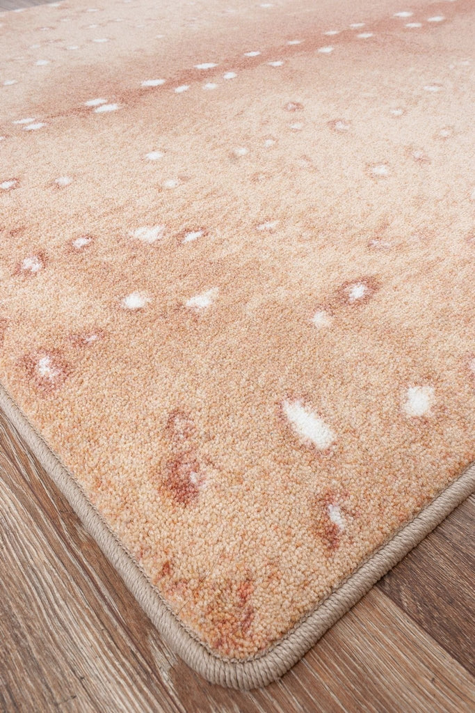Blush spotted axis hide area rug corner detail - Made in the USA - Your Western Decor