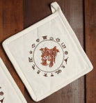 Ivory pot holders with embroidered boots, saddle, rope and brands 2 pieces - Your Western Decor