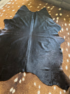 Black Brazilian cowhide rug with rich brown undertones natural hair on hide Western decor