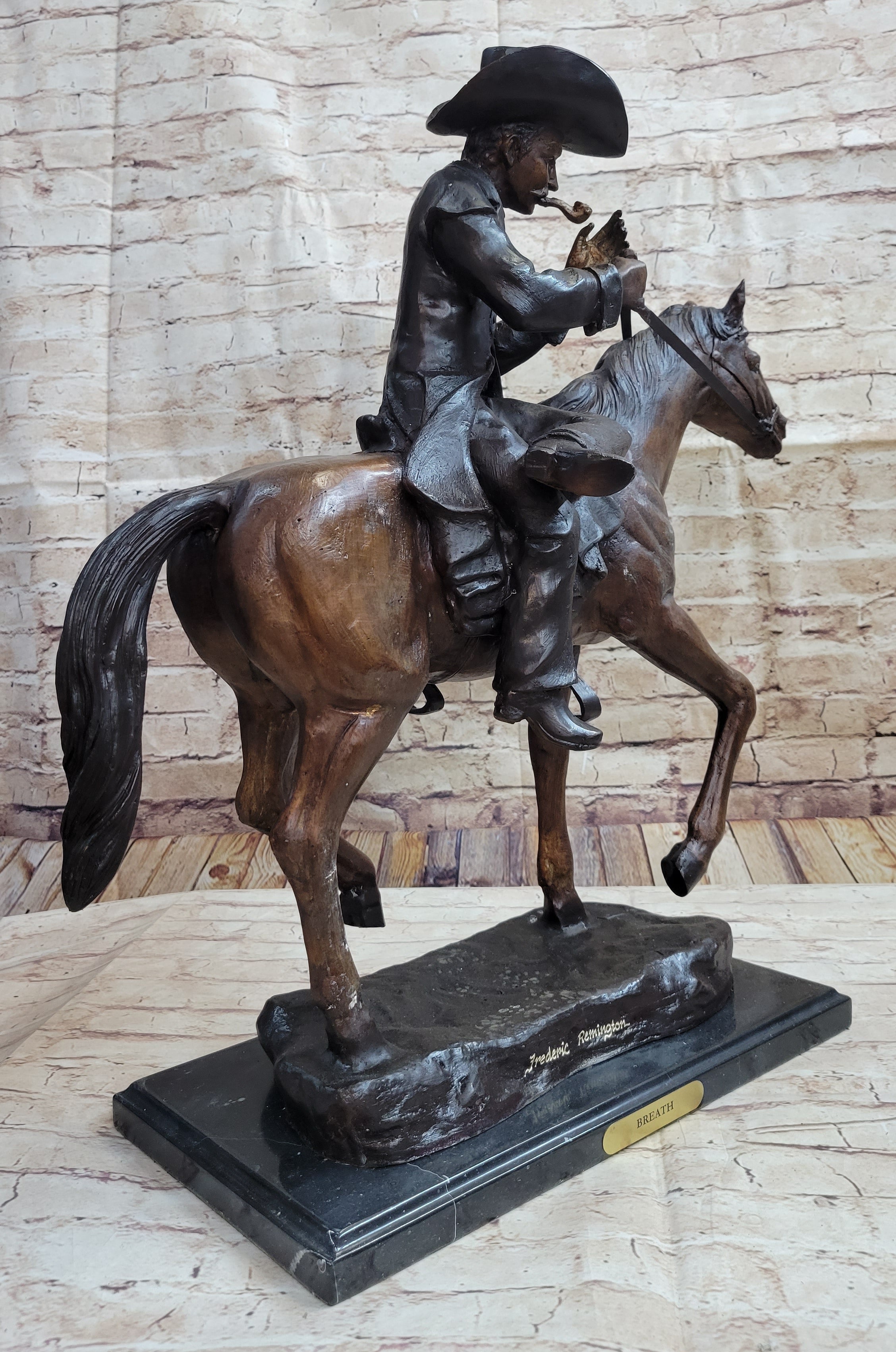 Breath Cowboy Lighting Pipe on Horse, bronze sculpture by Frederic Remington - Your Western Decor