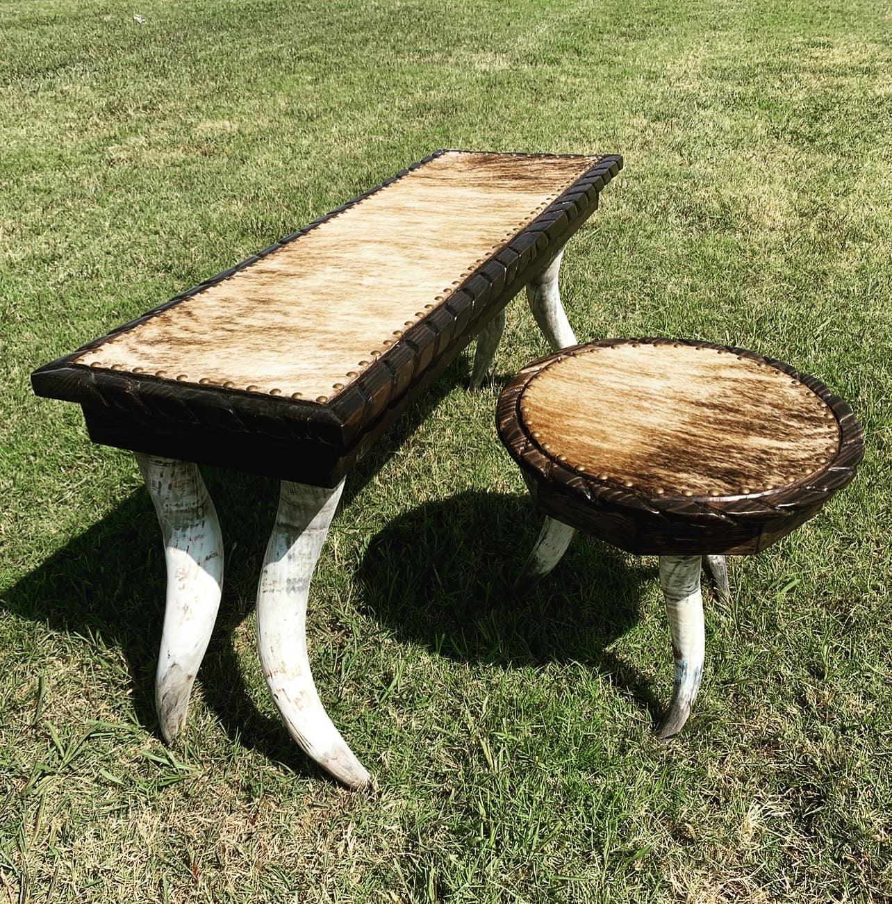 Western sofa table and end table on longhorn steer legs with brindle cowhide surfaces and nail trim 