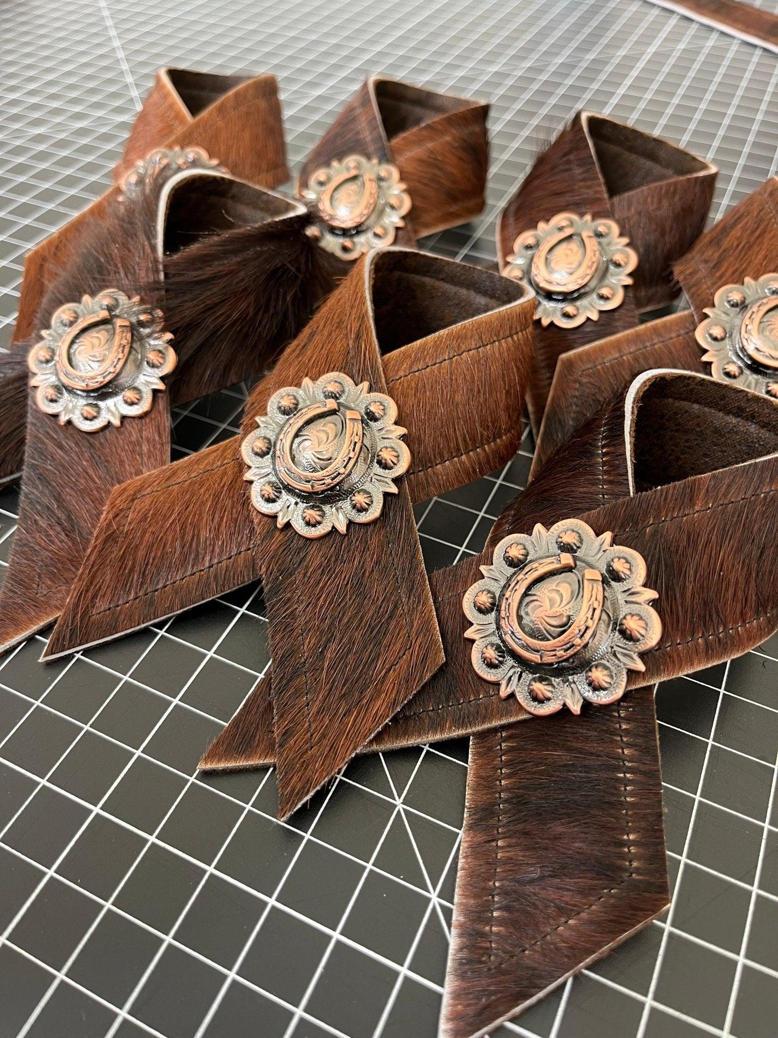 Brindle cowhide and horseshoe concho napkin rings handmade in the USA by Your Western Decor