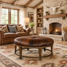 Luxury western living room featuring a brindle cowhide round cocktail ottoman