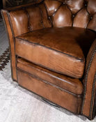 American made Brindle Cowhide & Tufted Leather Swivel Glider - Your Western Decor