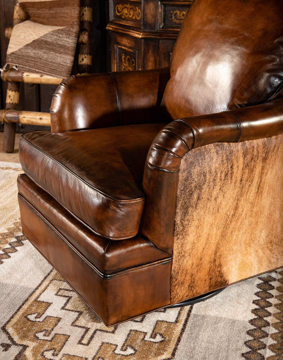 Dark brown burnished leather and brindle cowhide upholstered swivel glider chair made in the USA - Your Western Decor