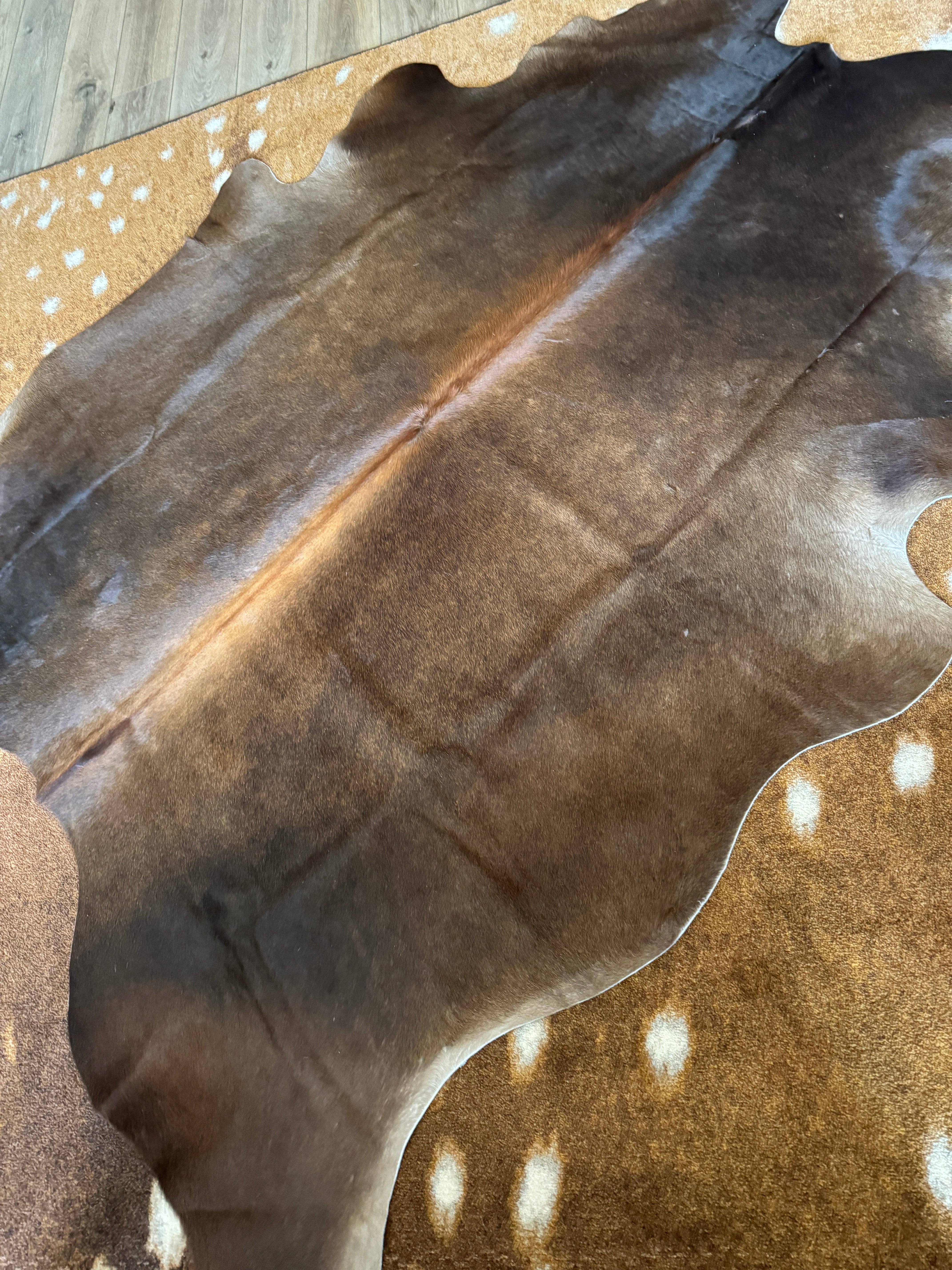 Brown Brazilian cowhide rug with natural tones premium hair on hide western decor