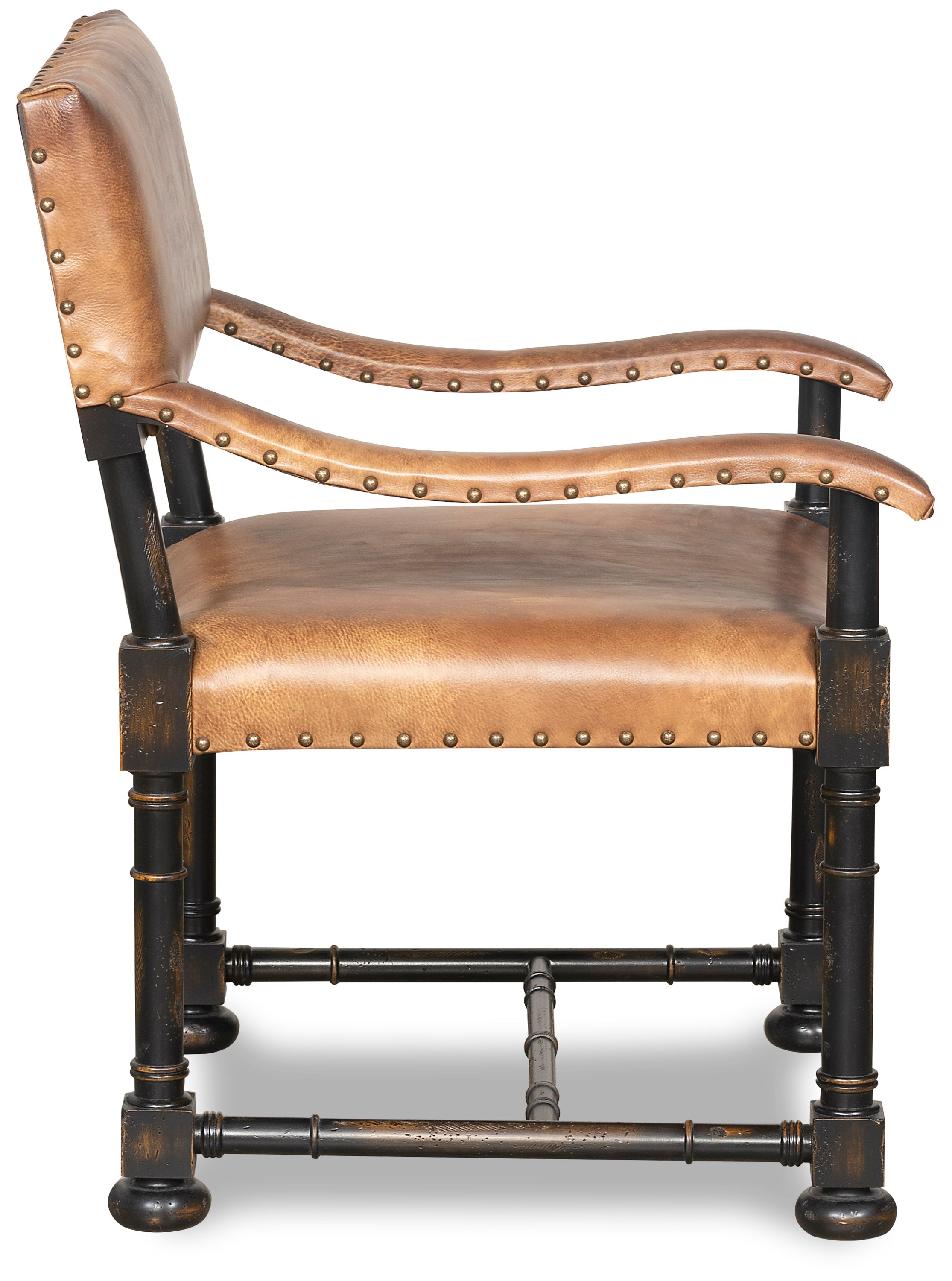 Brown leather accent chair with exposed wood frame and nail trim side view
