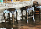 American made brown peppered cowhide western counter stools at stone kitchen counter