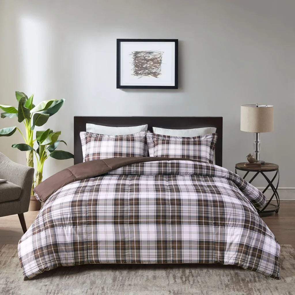 Brown plaid bedding set on a bed in a bedroom with a lamp and plant - Your Western Decor