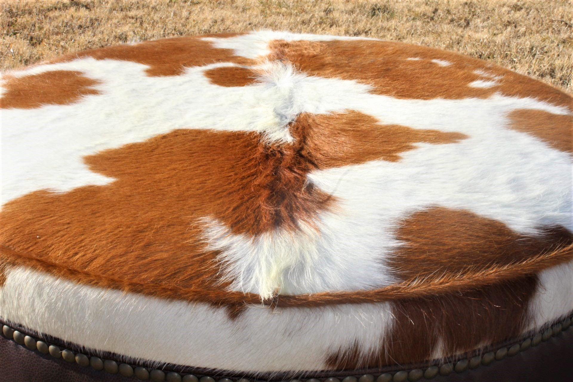 Western ottoman with brown leather and brown and white cowhide - handmade in the USA 