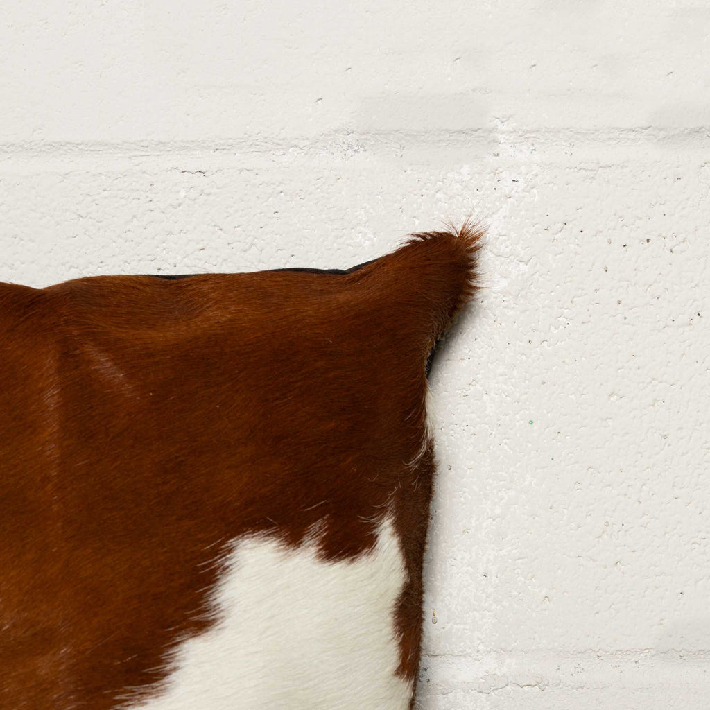 Brown & White Cowhide Pillow Corner Detail - Your Western Decor