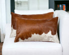 Brown and white oblong cowhide pillow pair 