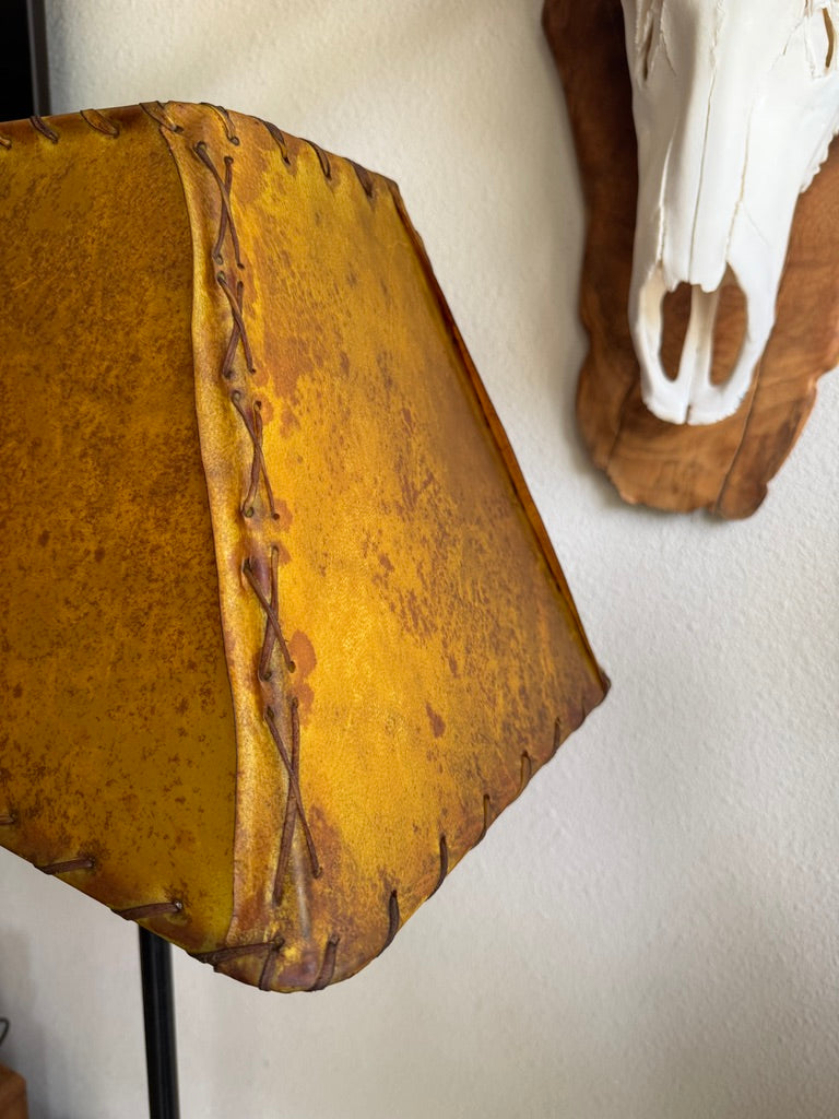 Hand-laced buckskin rawhide rectangle lamp shade showing handcrafted whip stitching and natural veining