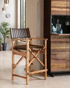 Wooden director's chair in a kitchen setting with a wooden cabinet and plants - Your Western Decor