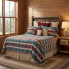 Log bed and nightstand. Bedding is turquoise, blue, orange, red geometric southwestern collection 