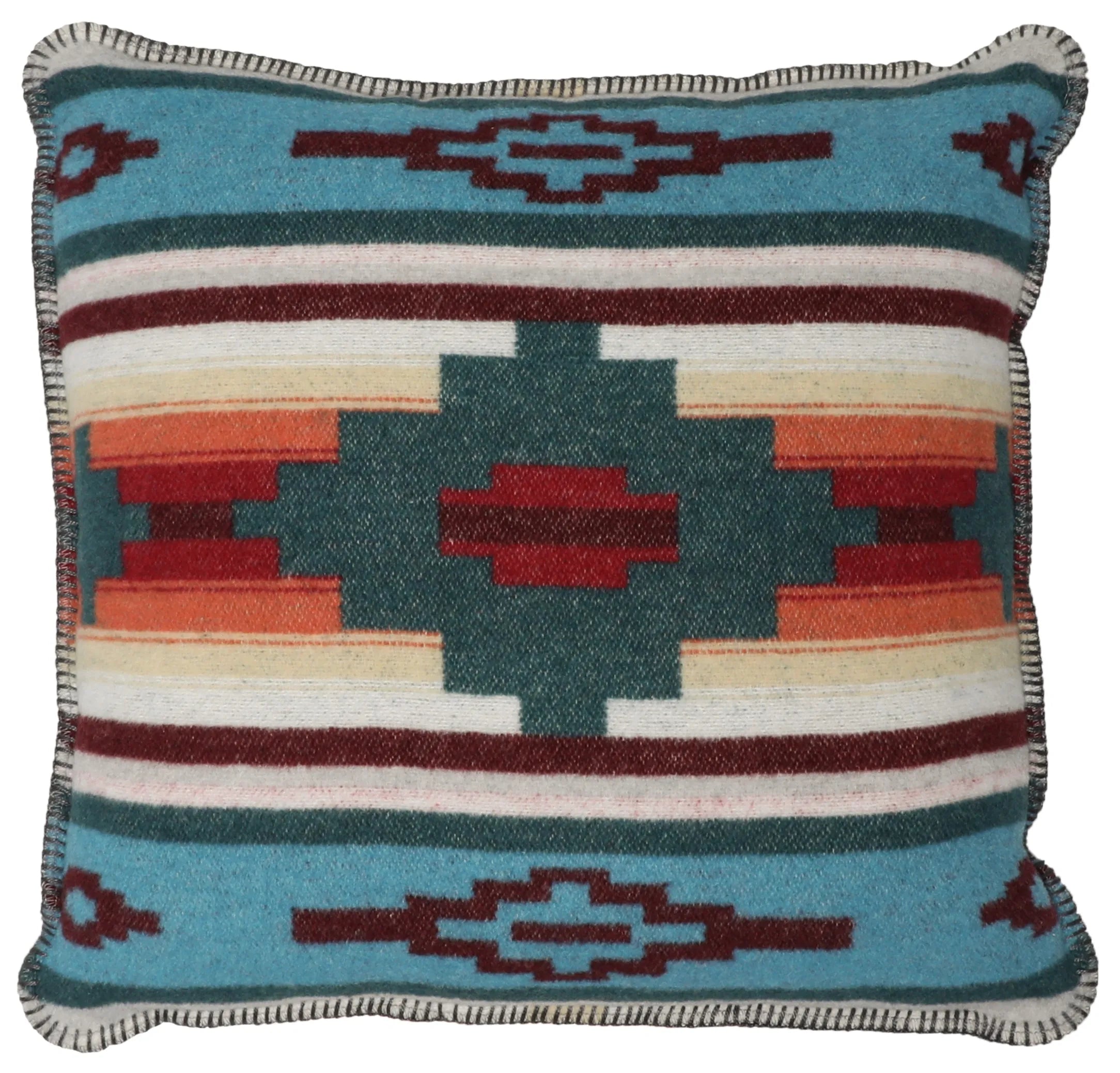 A square woven throw pillow featuring a Southwestern geometric pattern in turquoise, dark teal, rust red, orange, cream, and dark brown, finished with a fringed edge. Handmade in the USA