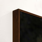 Dark wood frame detail on buffalo canvas art