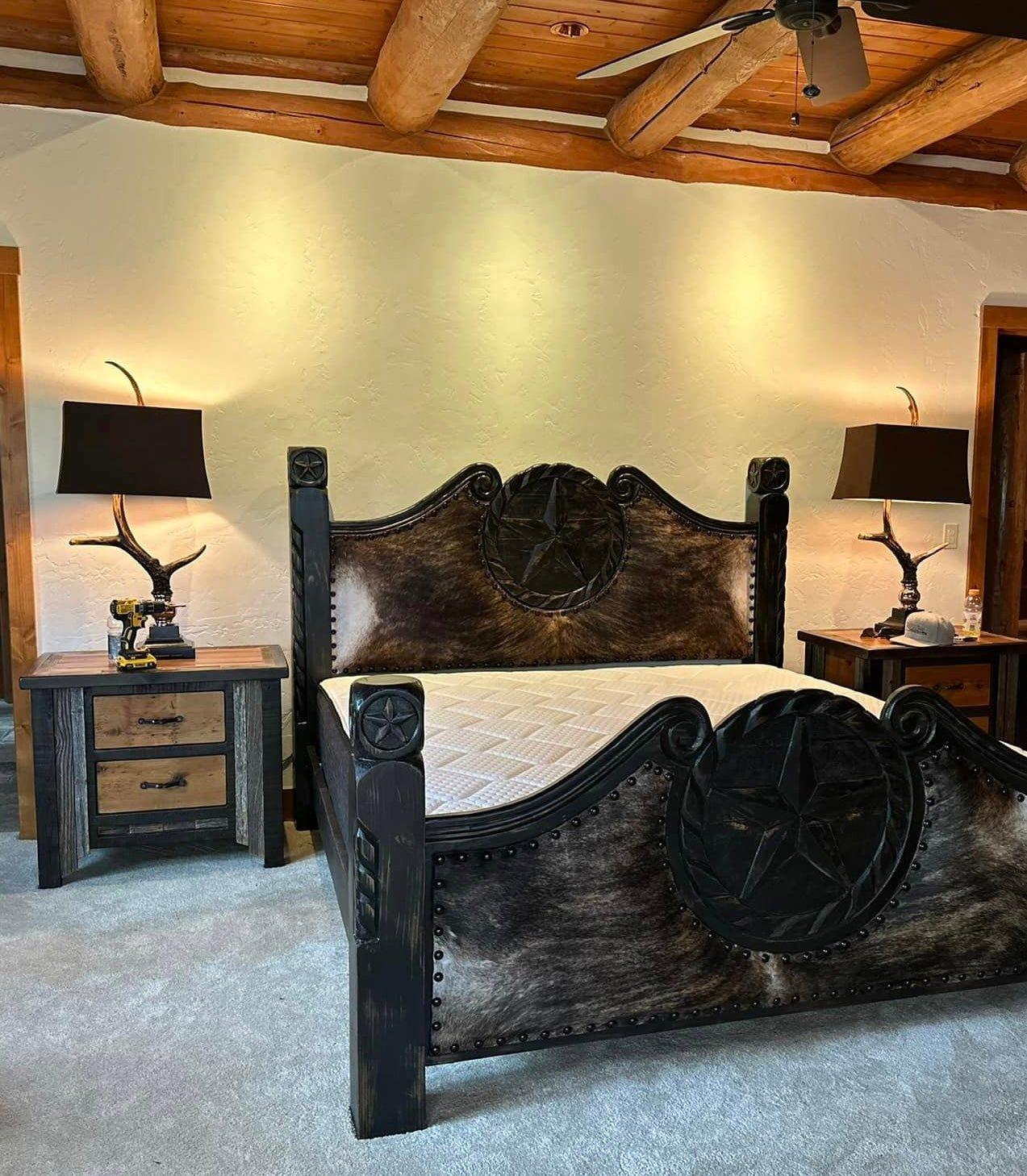 Burnished antler lamps in bedroom with western cowhide bed - Your Western Decor