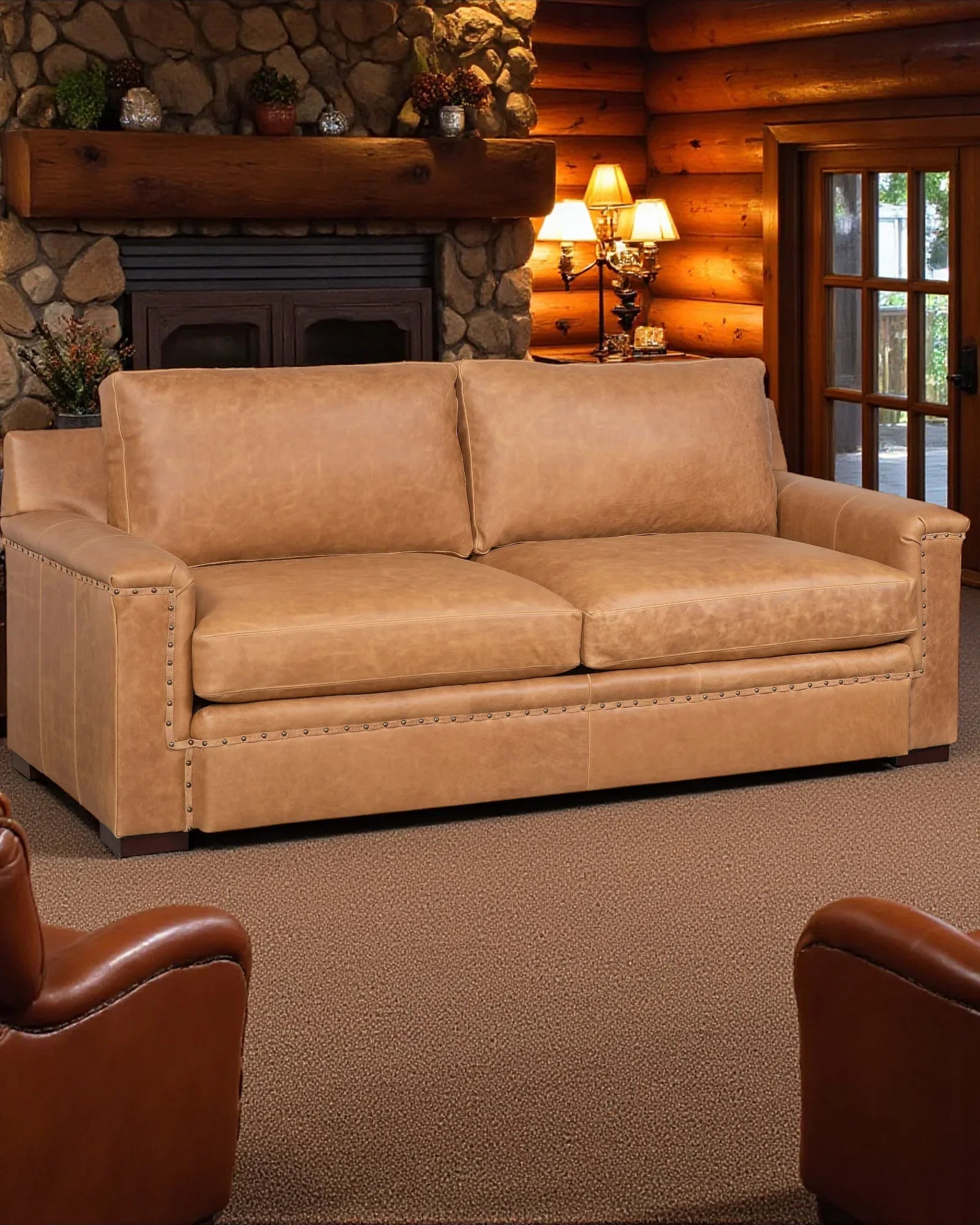 Brown sofa in a cozy living room with wooden walls and a fireplace - Your Western Decor
