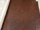 brown western canteen faux leather fabric on the roll 