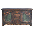 An ornate dark brown wooden chest or sideboard with carved floral details, three drawers in the center, and two front cabinet doors with green croc leather inserts, shown on a plain white background.