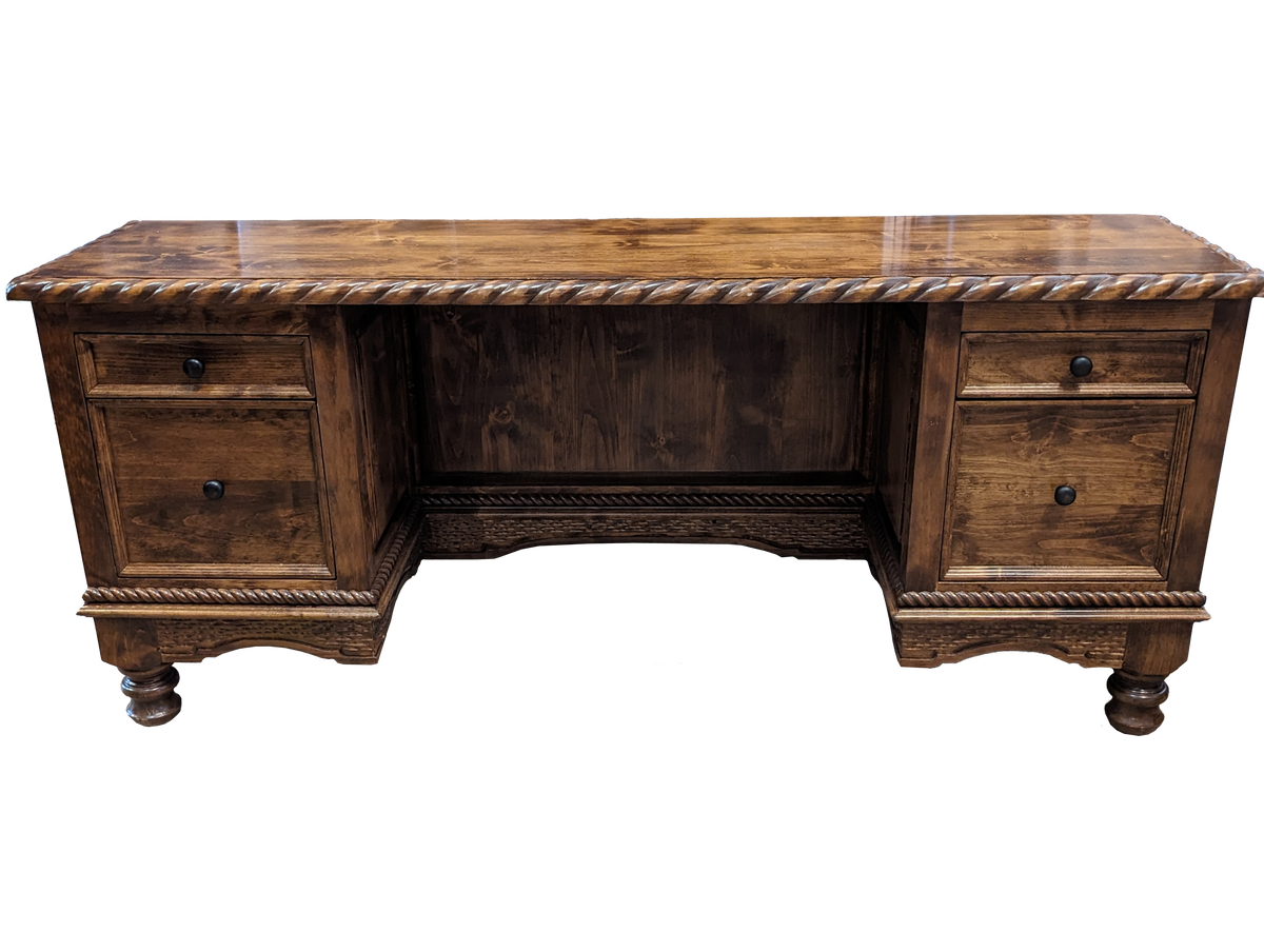 A rustic dark brown wooden writing desk with a twisted rope trim along the top edge, featuring two drawers on each side and turned wooden feet.