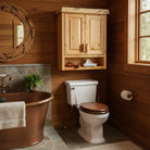 Bathroom with wooden walls, a copper bathtub, and a wooden cabinet - YOur Western Decor