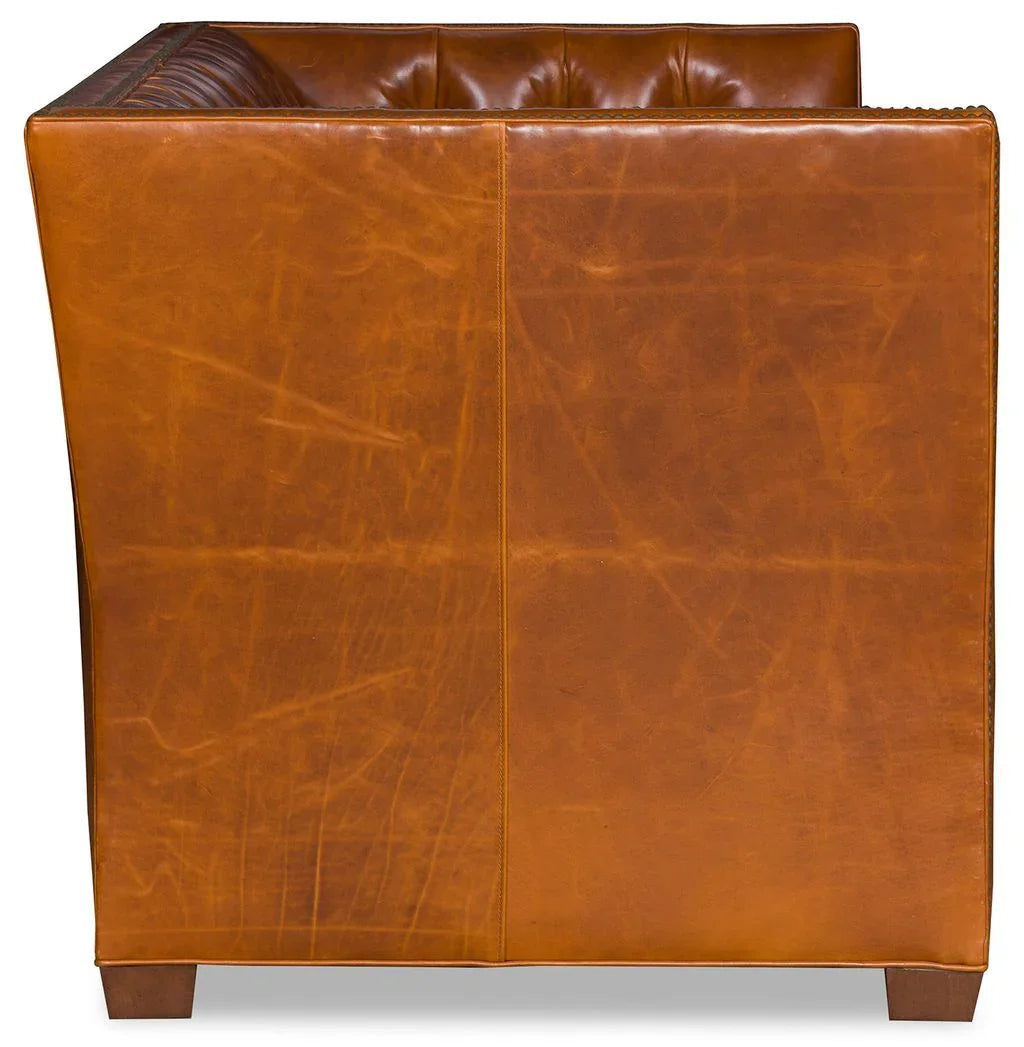 Chestnut tufted leather sofa side view - Your Western Decor