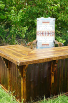 Rustic corner desk with Chief Joseph fabric upholstered Southwestern office chair outdoors 