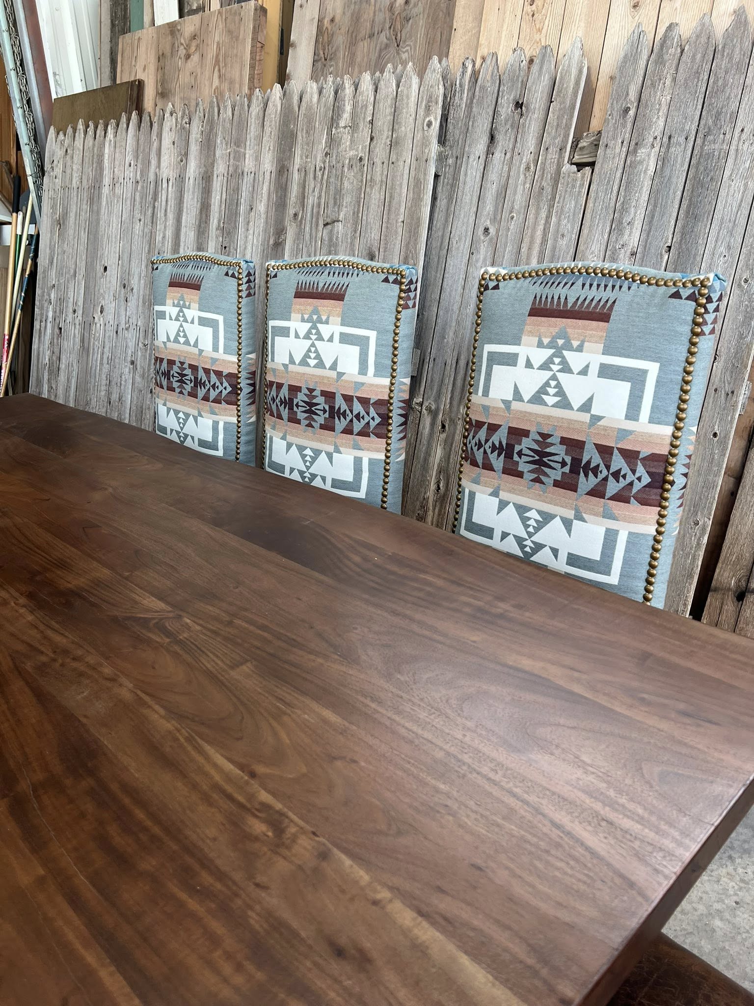 Chief Joseph Pendleton Sunbrella fabric dining chairs at wood table 