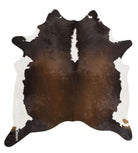 real cowhide rug in chocolate brown and white, western decor hide rug