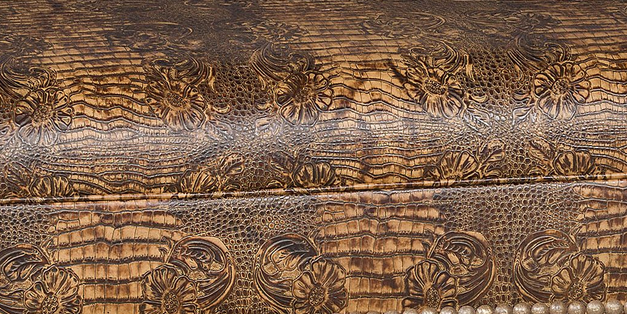 Close-up of croc embossed full-grain leather on Caden Western cocktail ottoman
